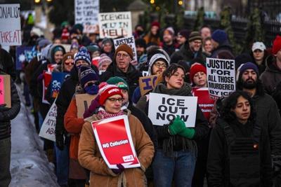 People take part in an anti-ICE protest outside the governor's residence in St. Paul, Minn., on Feb. 6, 2026.
