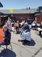 Family and friends parade cheers seniors