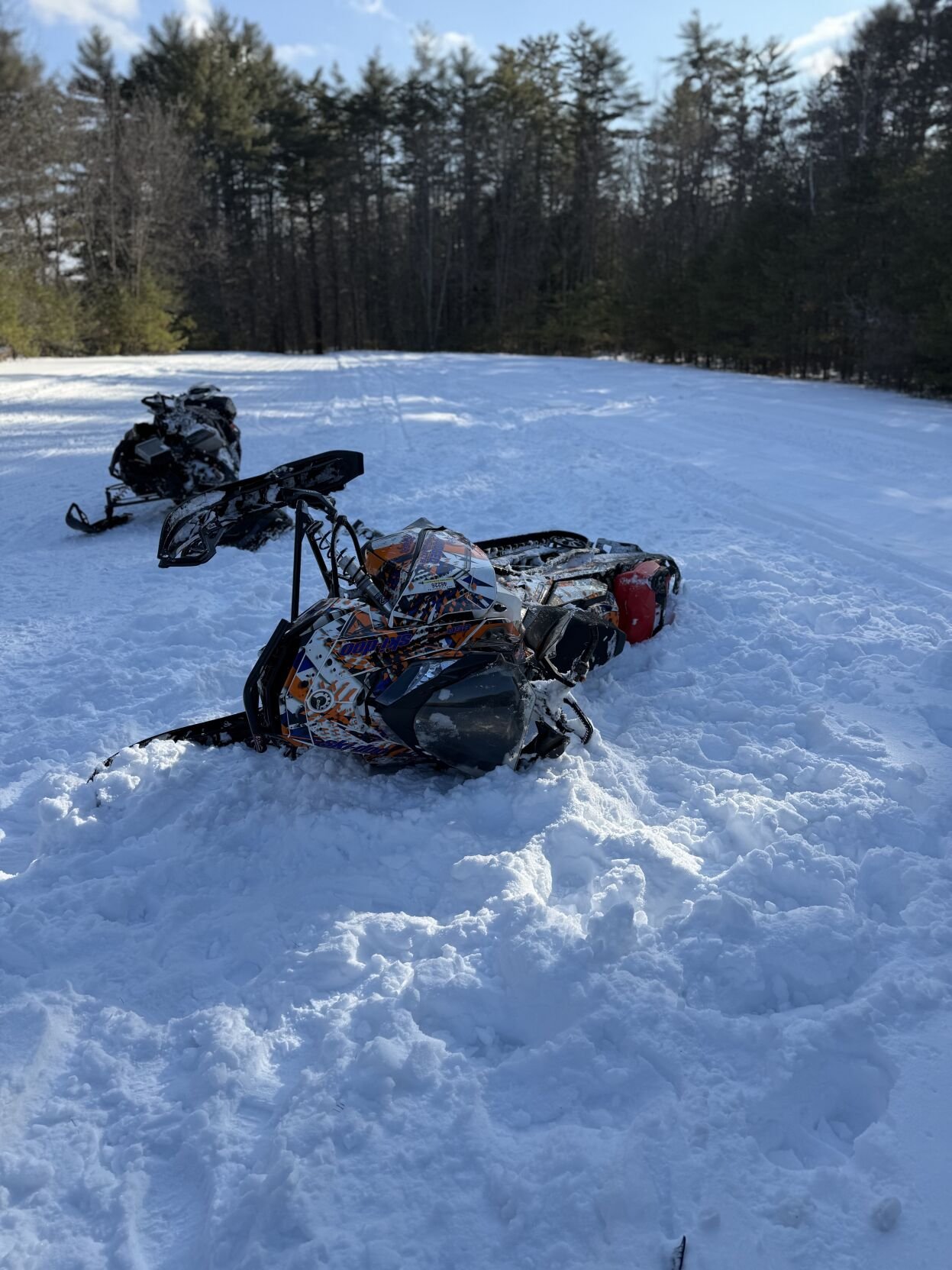 2 snowmobiles