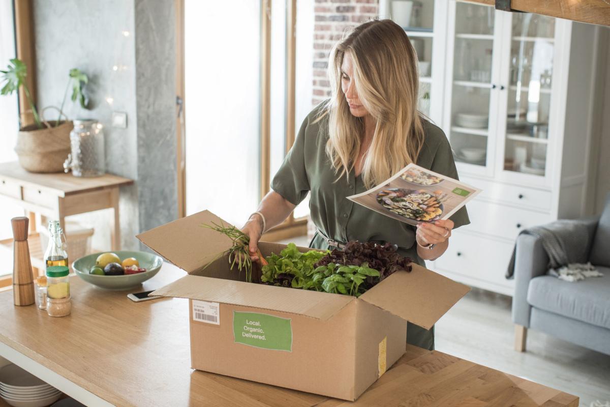 Woman got package from meal delivery service.