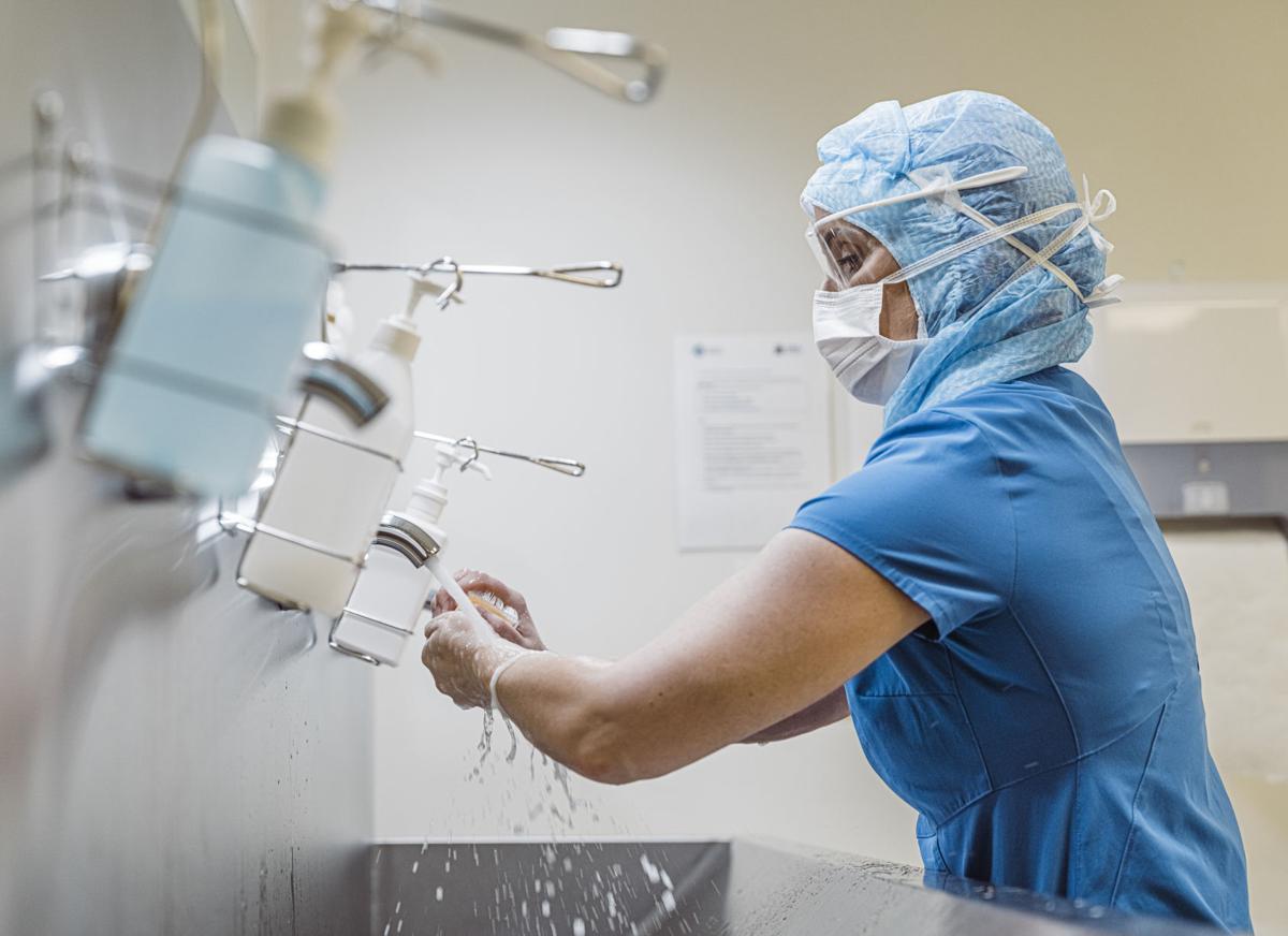 Nurse washing hands to avoid Covid 19 virus.