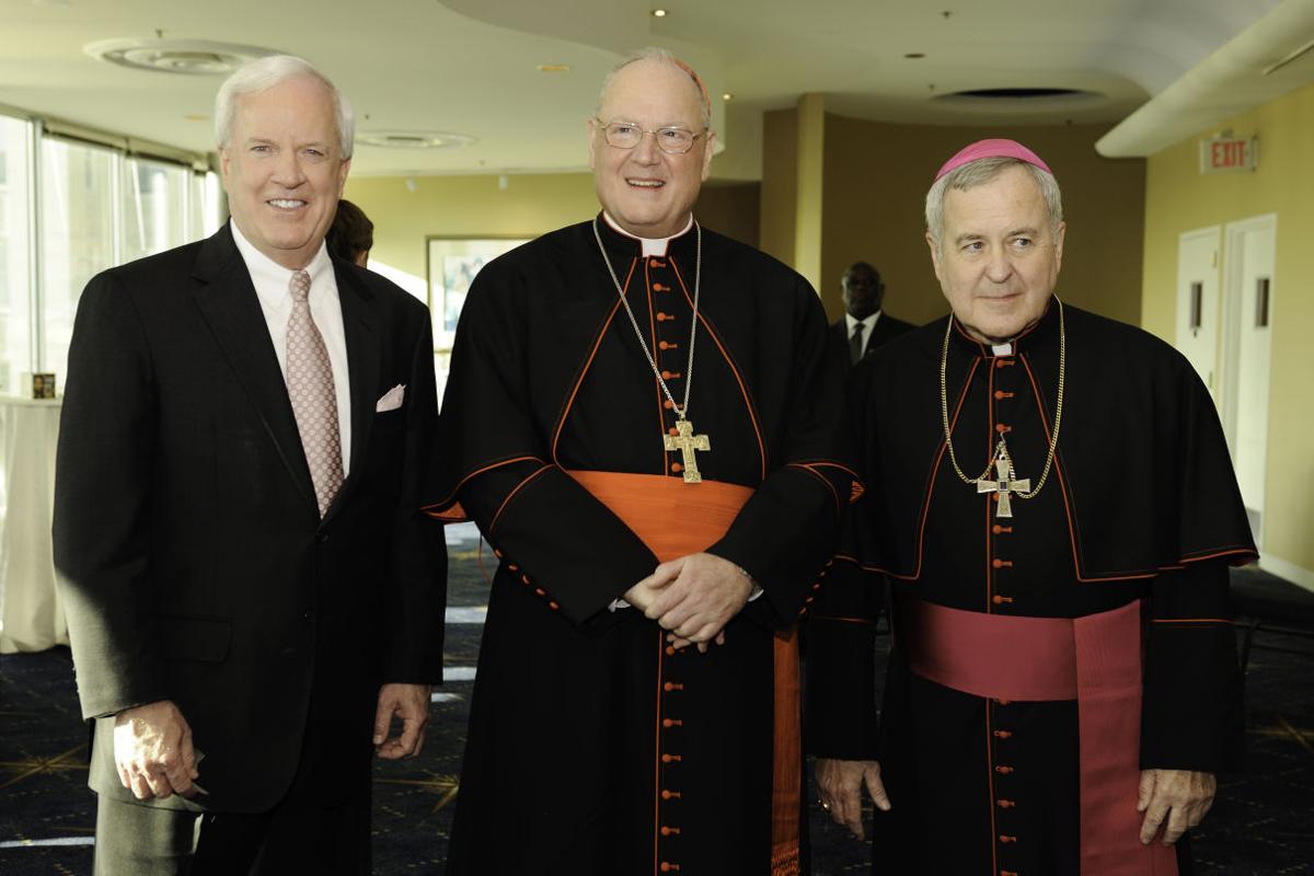 Pat Sly, Cardinal Timothy Dolan, Archbishop Robert Carlson