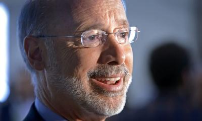 DAN MARSCHKA | Staff Photographer photos Gov. Tom Wolf speaks to reporters after attending an event Thursday in Lancaster. Wolf says the budget deal “moves Pennsylvania forward” with higher sales tax but lower property taxes.
