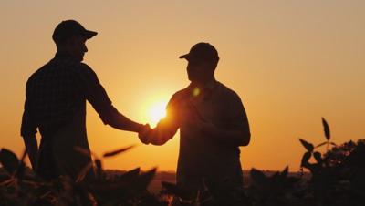 Farm workers handshake