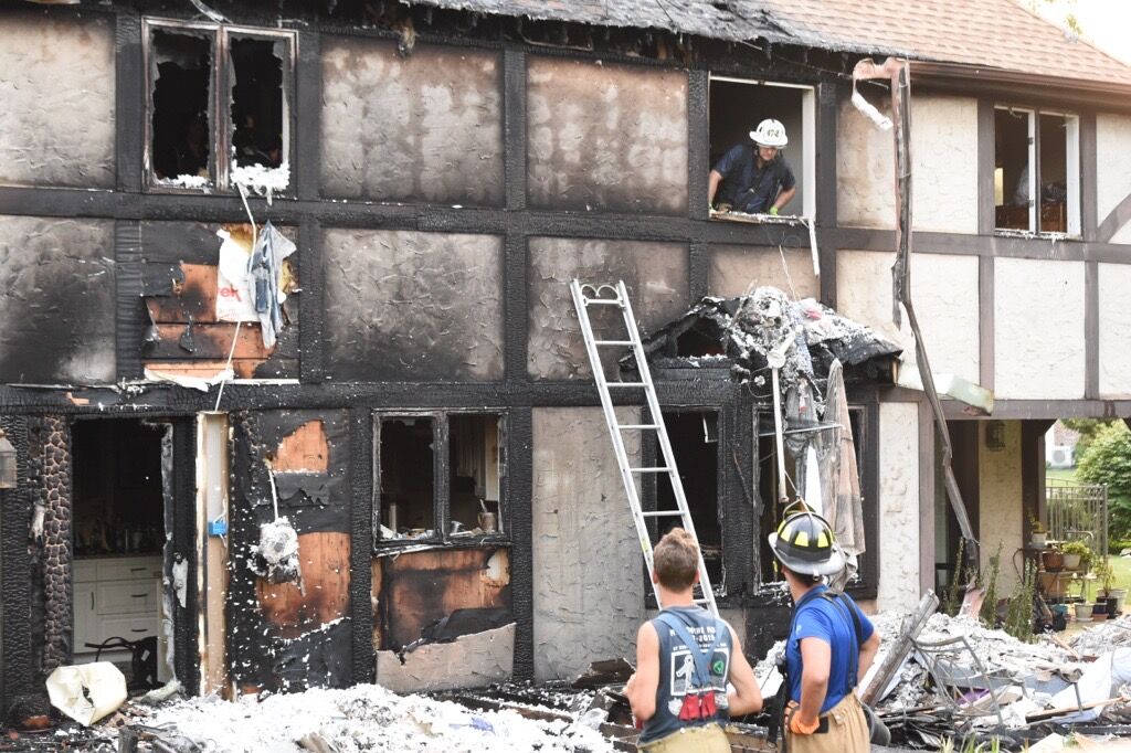 2 residents displaced after a backyard grill sparks house fire in