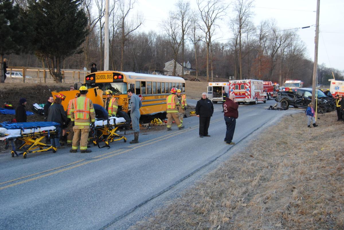 Motorist cited after crash involving school bus sent 15 students, 2