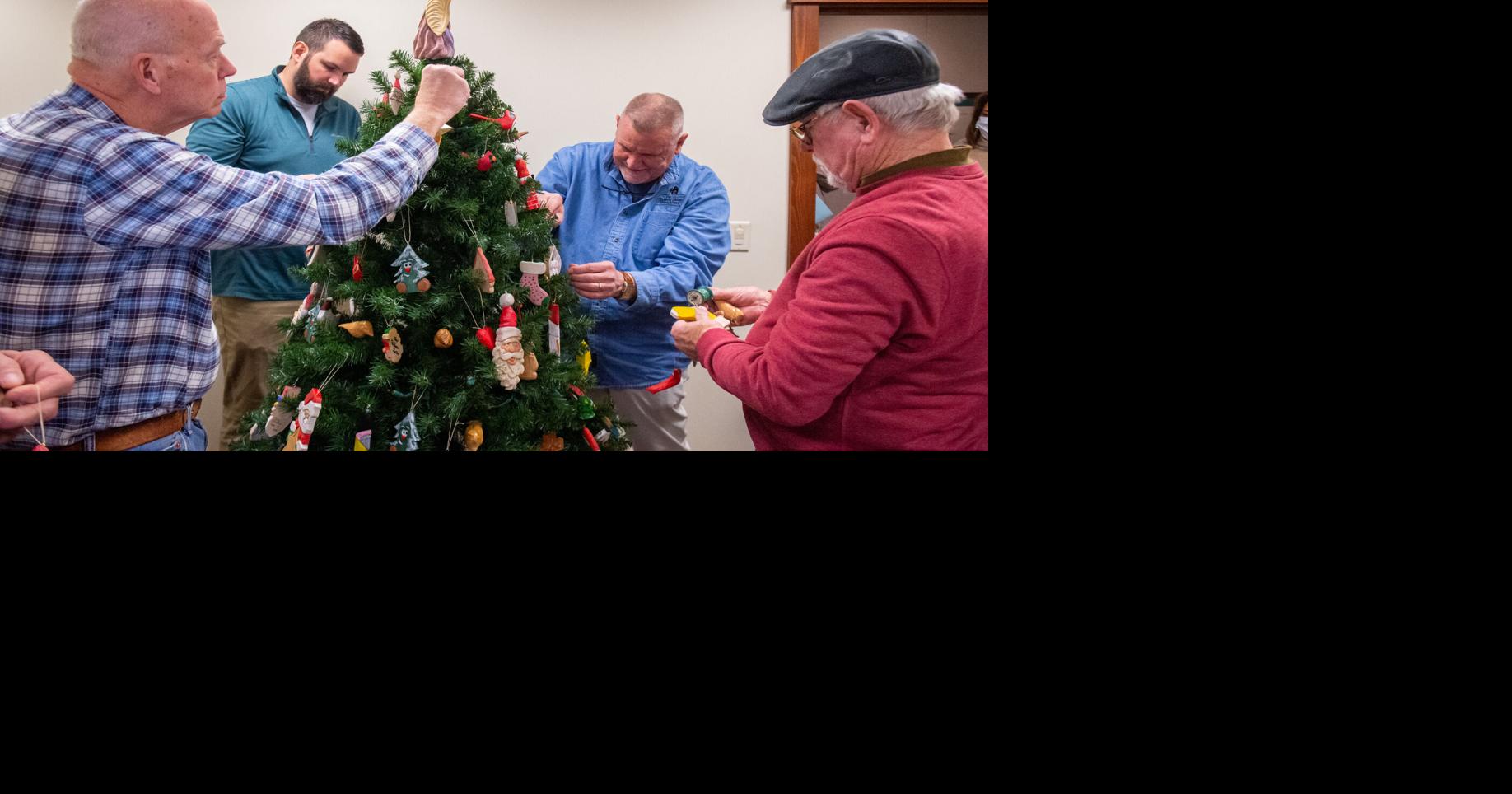 Woodcarvers decorate Hospice Christmas tree with carved ornaments