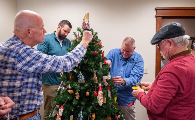Woodcarvers decorate Hospice Christmas tree with carved ornaments