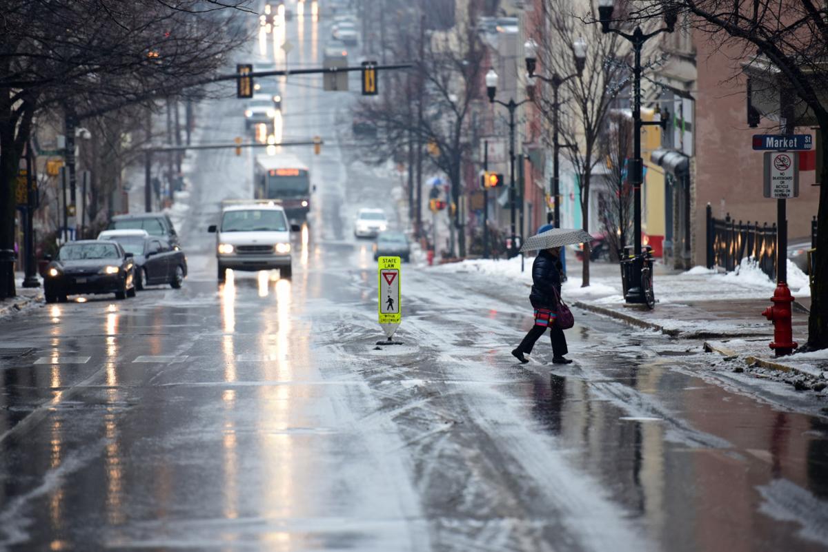 Freezing rain makes roads, sidewalks slippery, delays or closes schools ...