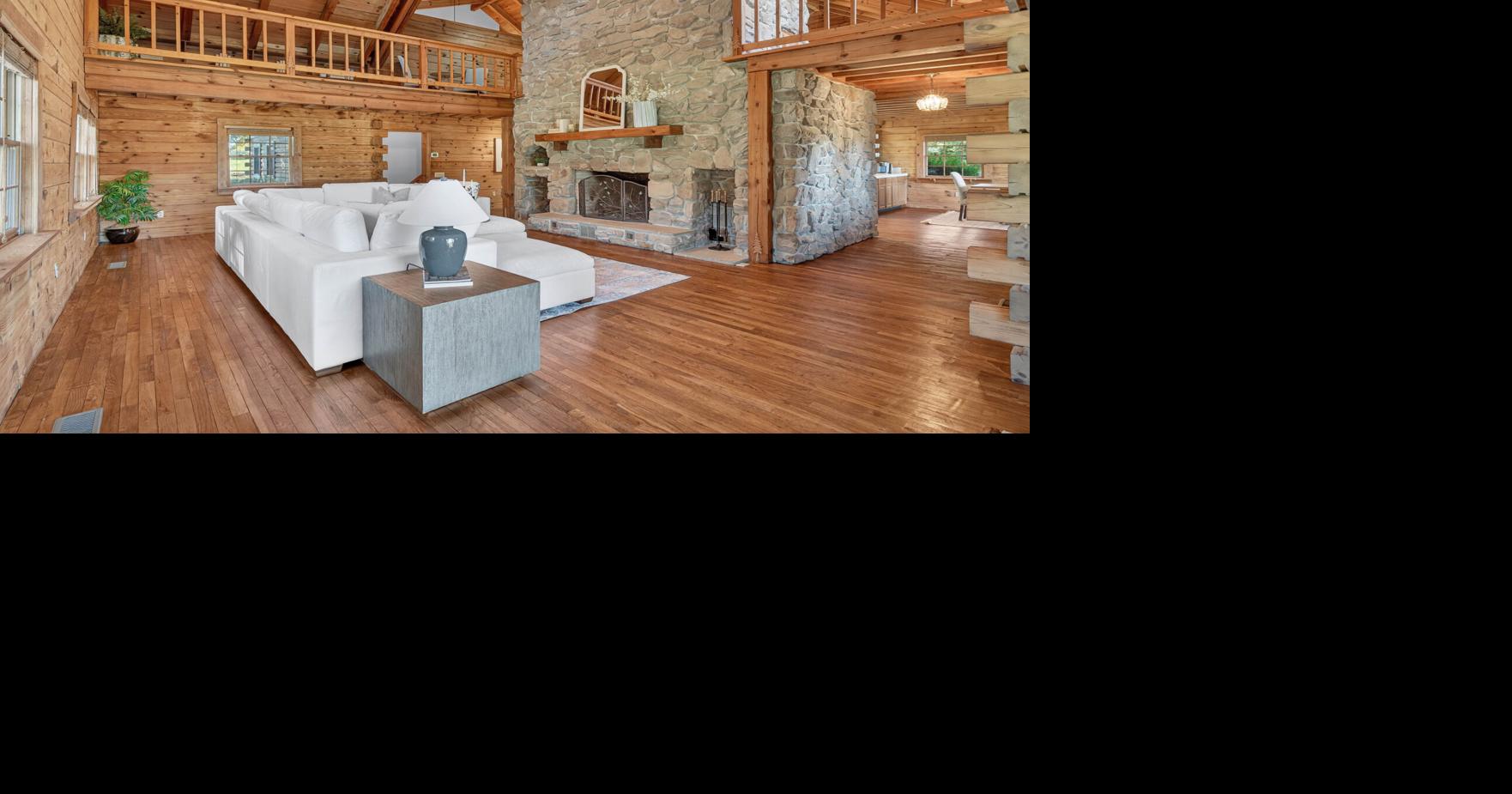 This custom southern end log home offers 'elevated' cozy