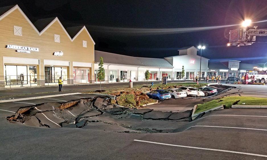 Massive sinkhole expanded overnight at Tanger Outlets parking lot in