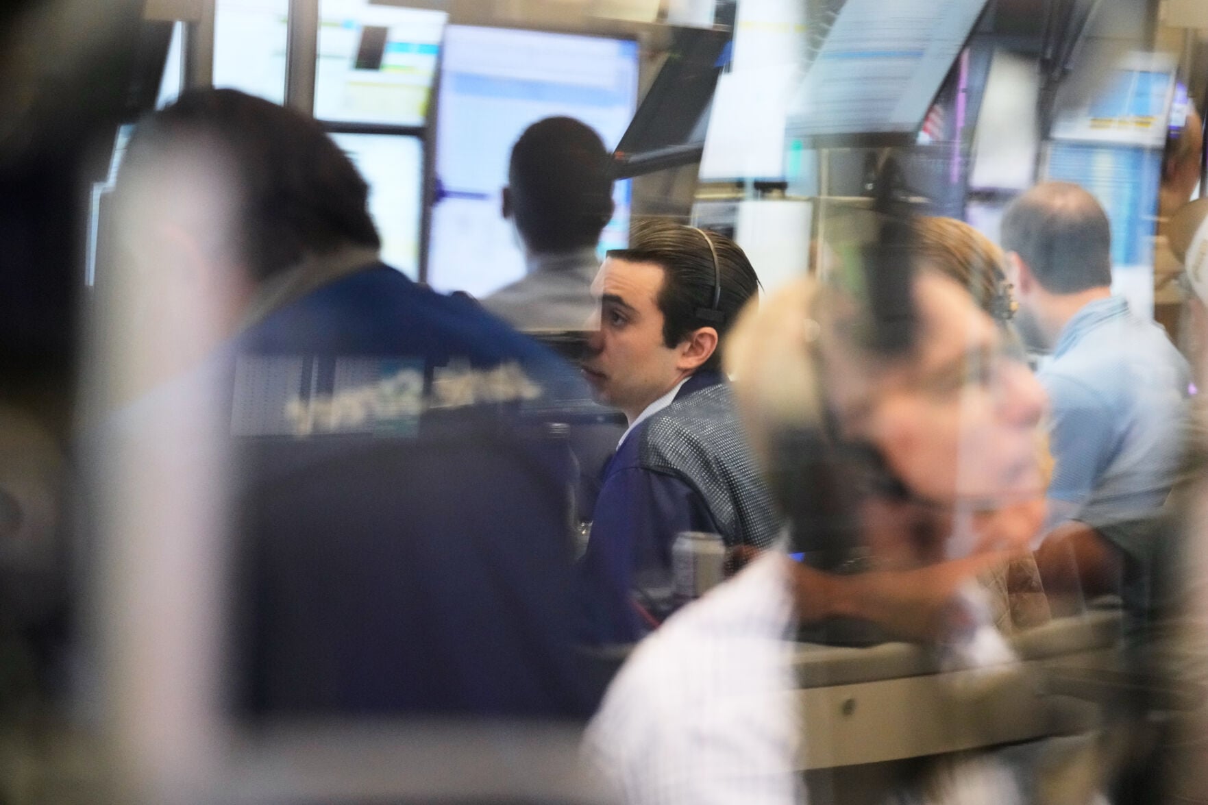 Rising bond yields rattle global markets, but tech stocks limit Wall Street losses as Micron's strong profit report fuels AI optimism