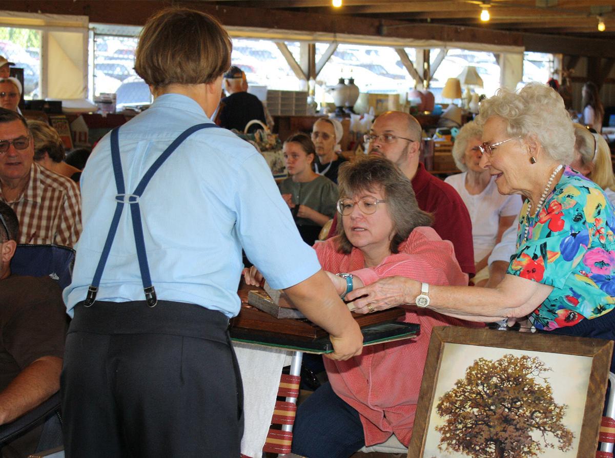 Amish volunteers give back to Hospice at Labor Day auction, serve up