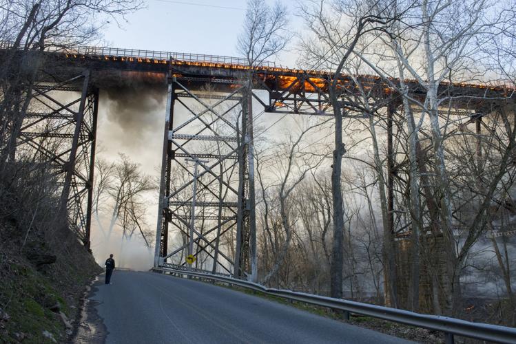 Deck of pedestrian bridge 'a loss' after fire strikes old railroad