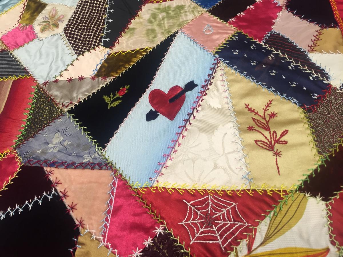 This vintage crazy quilt has everything from a velvet painting to an