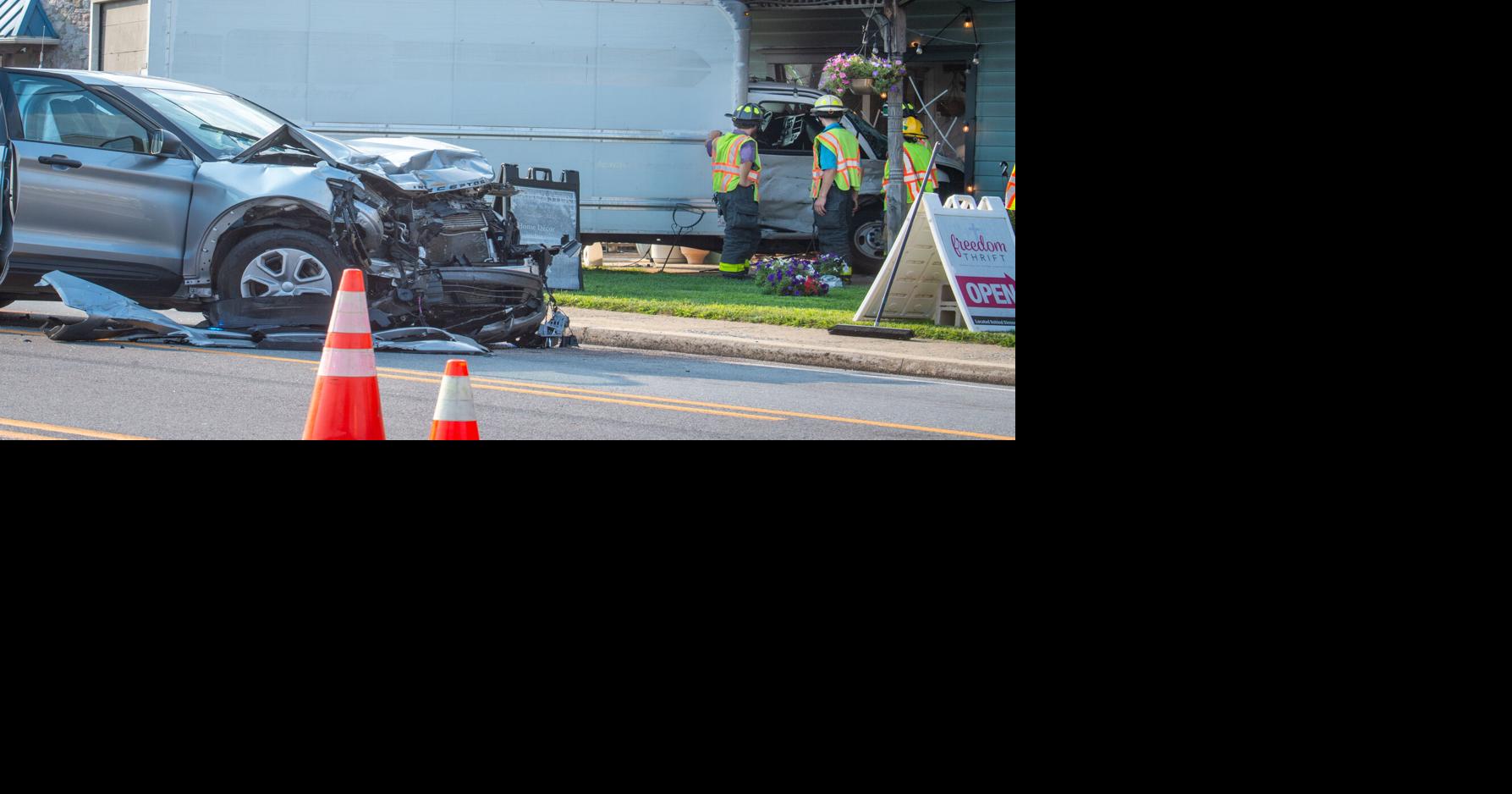 Box truck crashes into building, law enforcement vehicle on Lincoln ...