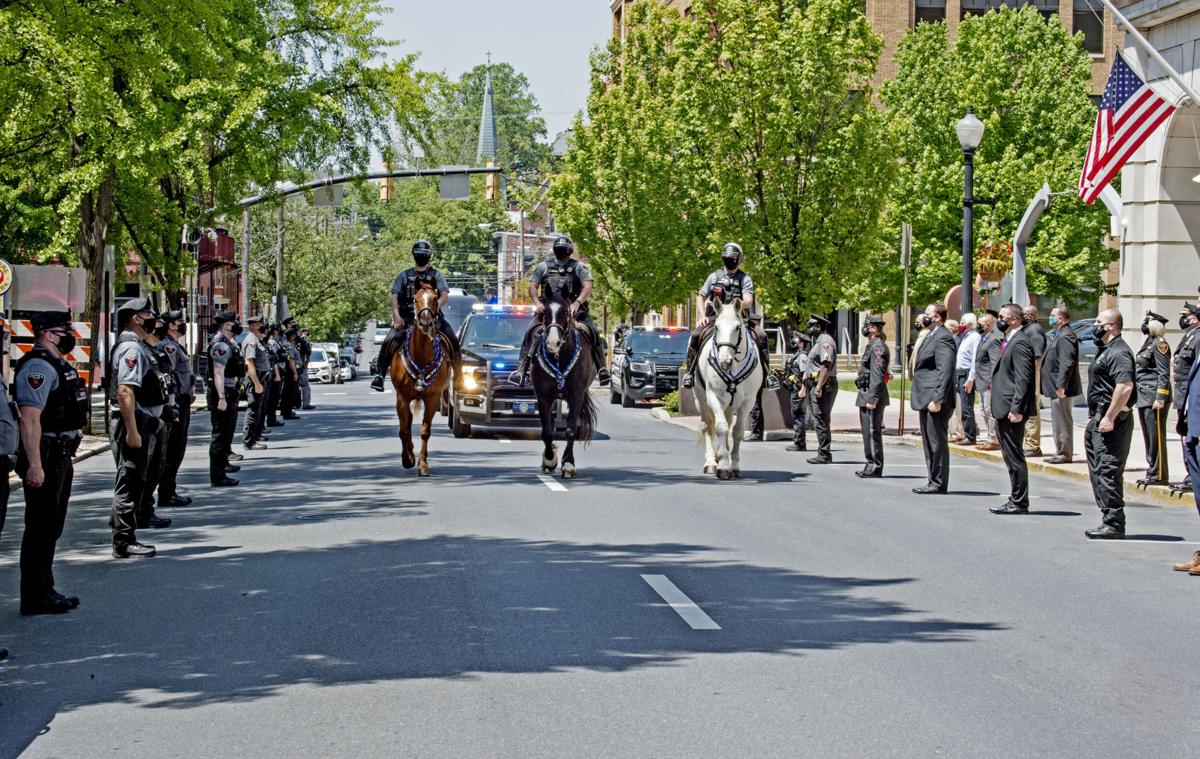 City police honor former lieutenant as funeral procession passes police