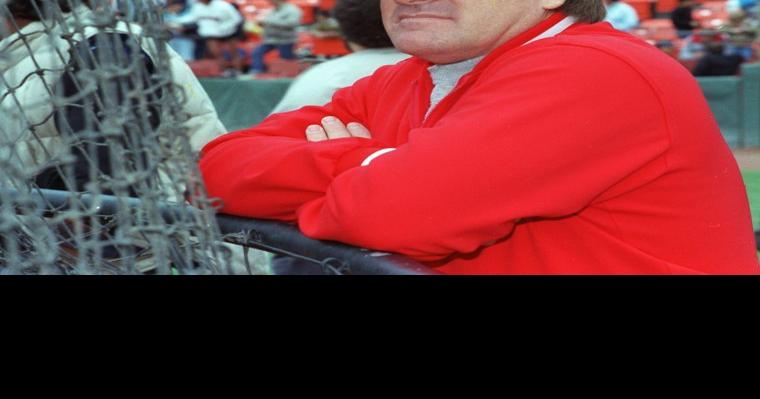 Former Cincinnati Reds manager Pete Rose hits a softball during