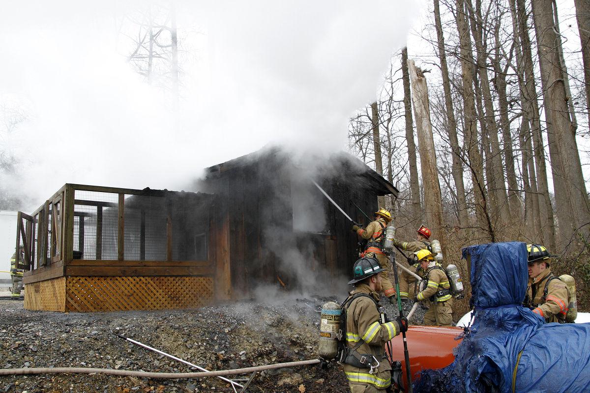 Fire chief, wife rescue dogs from burning kennel Local News ... pic