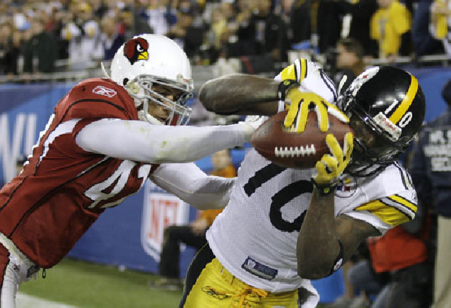 Arizona Cardinals' Larry Fitzgerald aided by Hines Ward