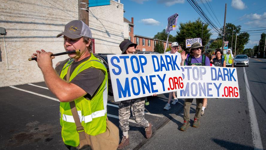 Protesters rally against dark money after 35mile march from Lancaster