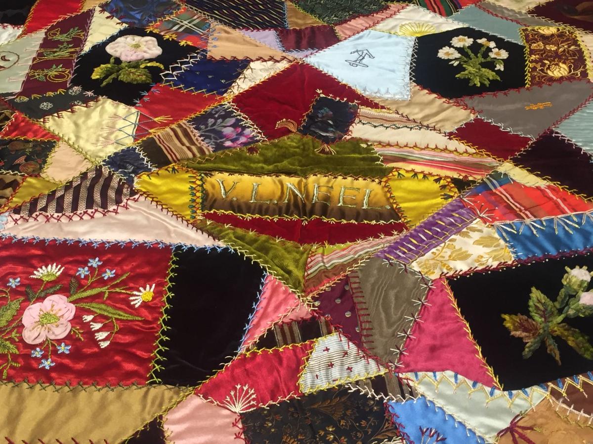 This vintage crazy quilt has everything from a velvet painting to an