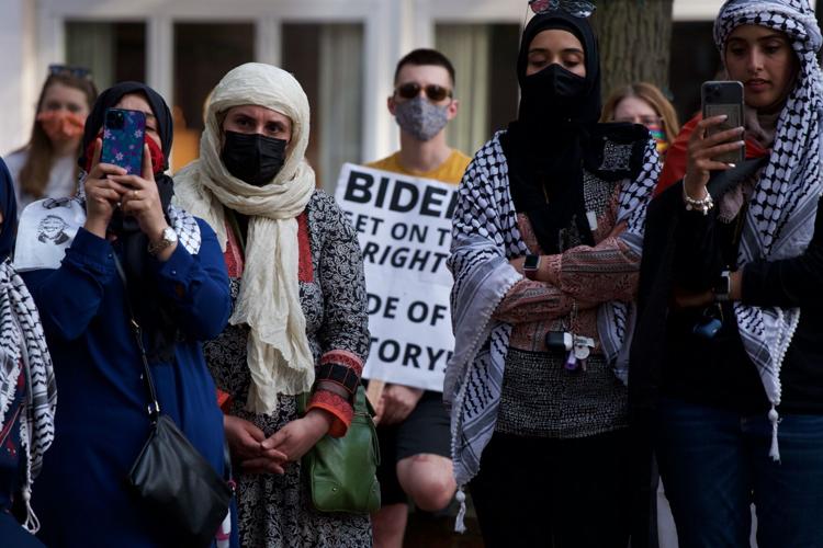 New York, United States. 14th May, 2021. A woman wearing keffiyeh attends  the rally. About 100 protesters staged rally against Israel during rally  Palestinian Liberation Within Our Lifetime Palistine on 53rd street.