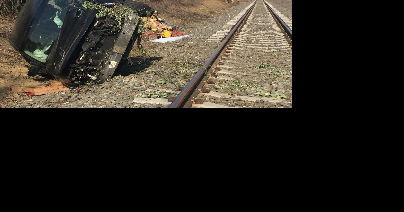 Vehicle overturns, ends up on train tracks in Paradise Township Monday
