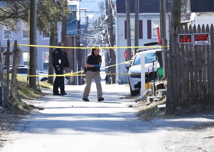 Couple charged after body found in basement freezer, police say