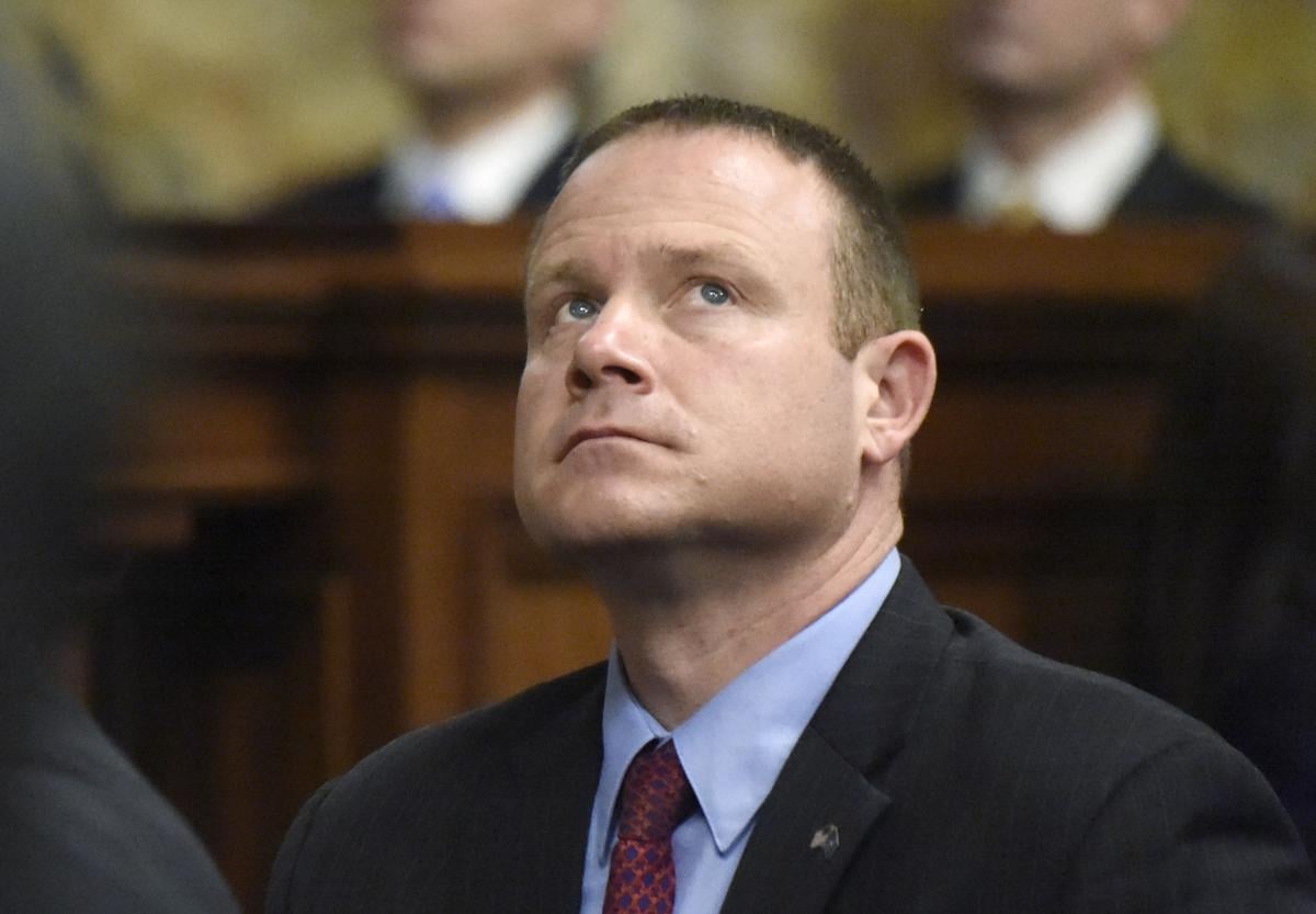 A celebratory state Capitol Lawmakers swear in for a new session in