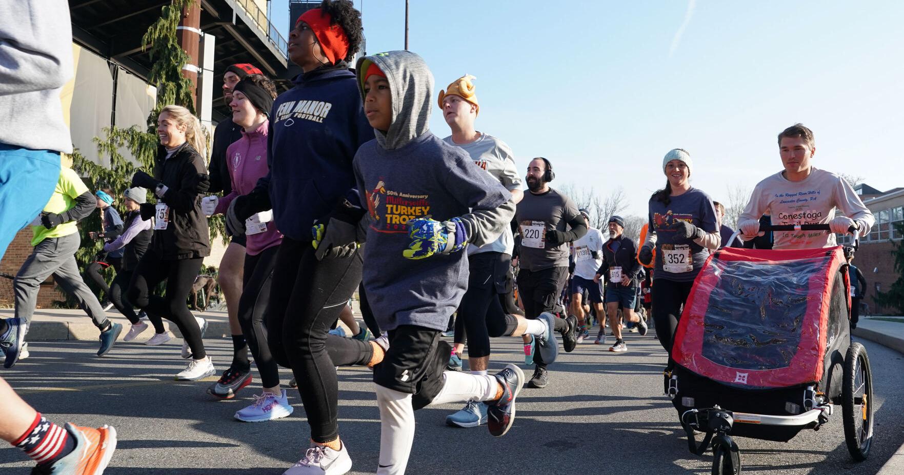Runners celebrate the 50th Millersville Turkey Trot