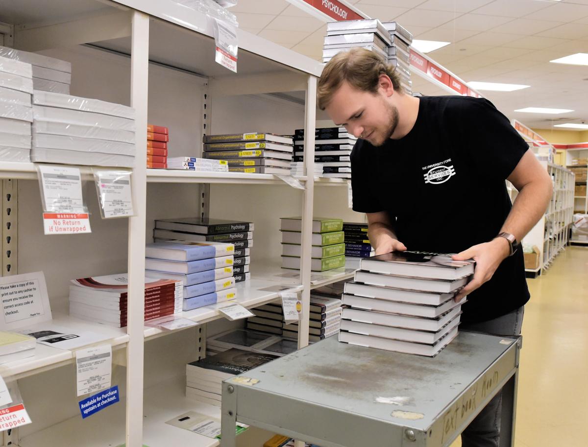 Buying college textbooks can be a lesson in spending — and saving