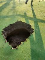 Evergreen golf owners, nearby quarry disagree over cause of sinkholes