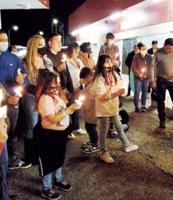 Candlelight vigil commemorates two murders