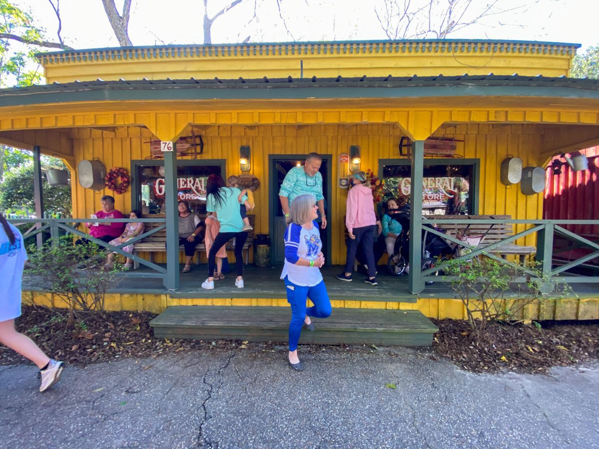 10.19 Landrum_s Fall Tyme Festival Customers mill about Landrum_s Homestead and Villages_ general store during the Fall Tyme Festival Saturday, Oct. 16, 2021..jpg