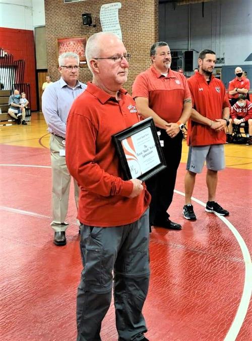 Longtime wrestling coach has gym named in his honor