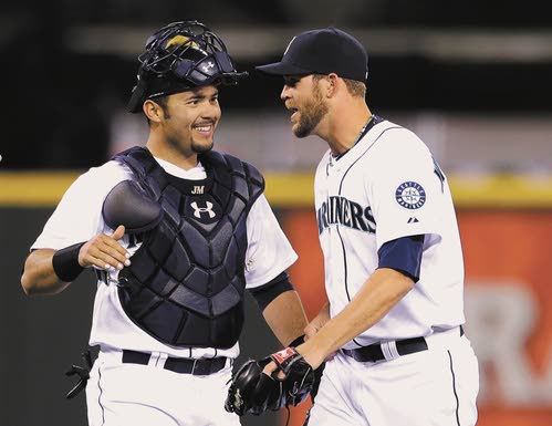 Seattle Mariners' Dustin Ackley connects with a pitch for a double