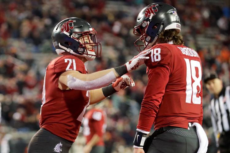 Anthony Gordon of the Washington State Cougars looks to throw the  Washington  state football, College football uniforms, Washington state cougars