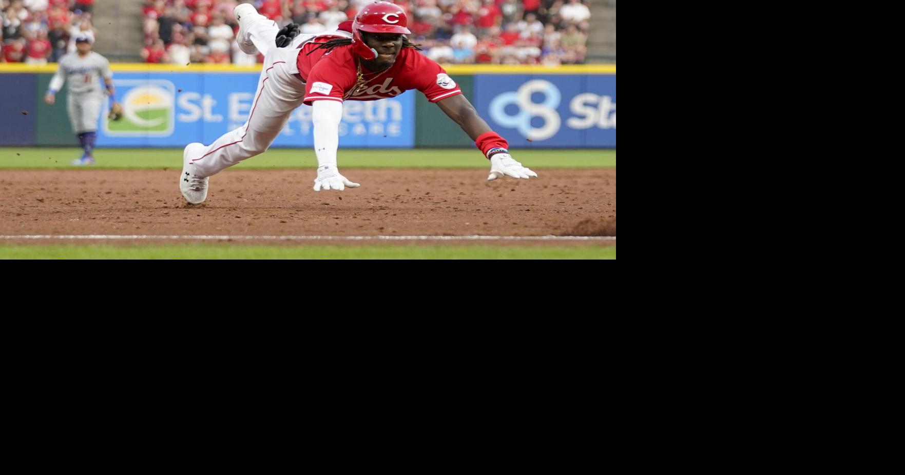 Reds Ken Griffey Jr. walks back to the dugout after striking out