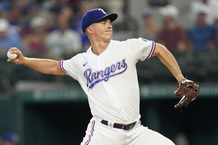 Texas Rangers' Ezequiel Duran looks up after hitting a single during the  second inning of a baseball game against the Seattle Mariners in Arlington,  Texas, Sunday, June 5, 2022. (AP Photo/LM Otero