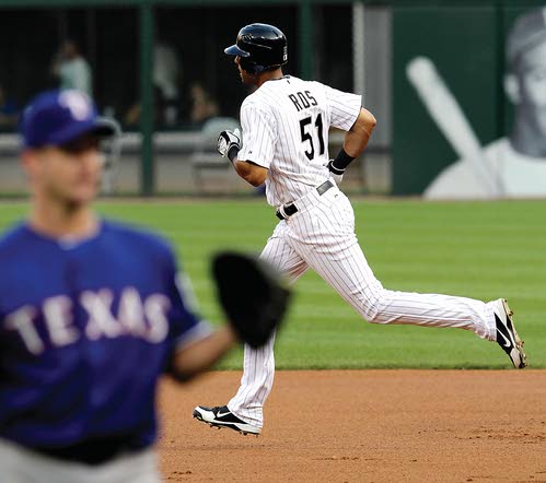 Seattle Mariners' Ichiro Suzuki eyes his soft liner that falls in