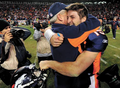 Denver Broncos quarterback Tim Tebow celebrates his 80 yd