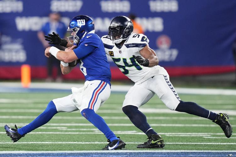Witherspoon scores on 97-yard pick six as defense leads Seattle