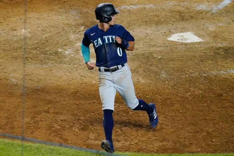 Sam Haggerty of the Seattle Mariners celebrates a run against the