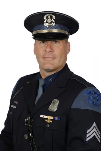 Michigan state trooper accused of fatally hitting a fleeing suspect with an SUV is charged with murder