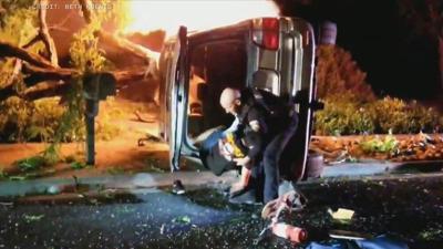 Dramatic video shows California officer rescue driver from fiery crash ...