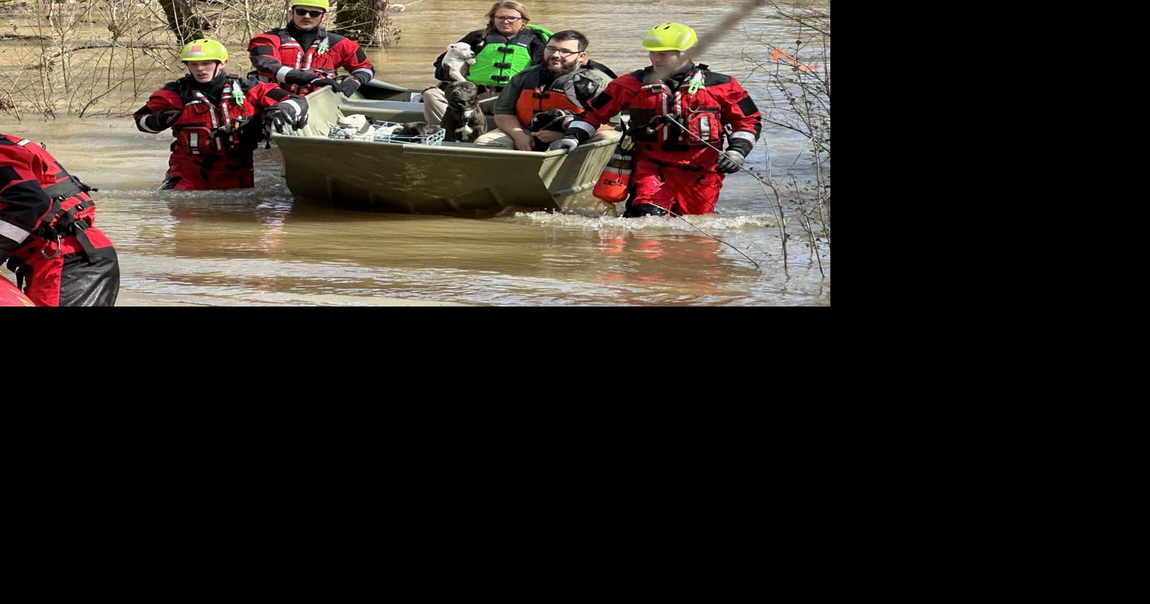UPDATE: Crews rescue 10 people, 14 dogs after homeless encampment trapped in flooding | Local News