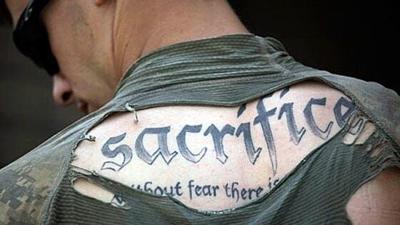 At ease: . Army loosens regulations for tattoos and hairstyles | |  