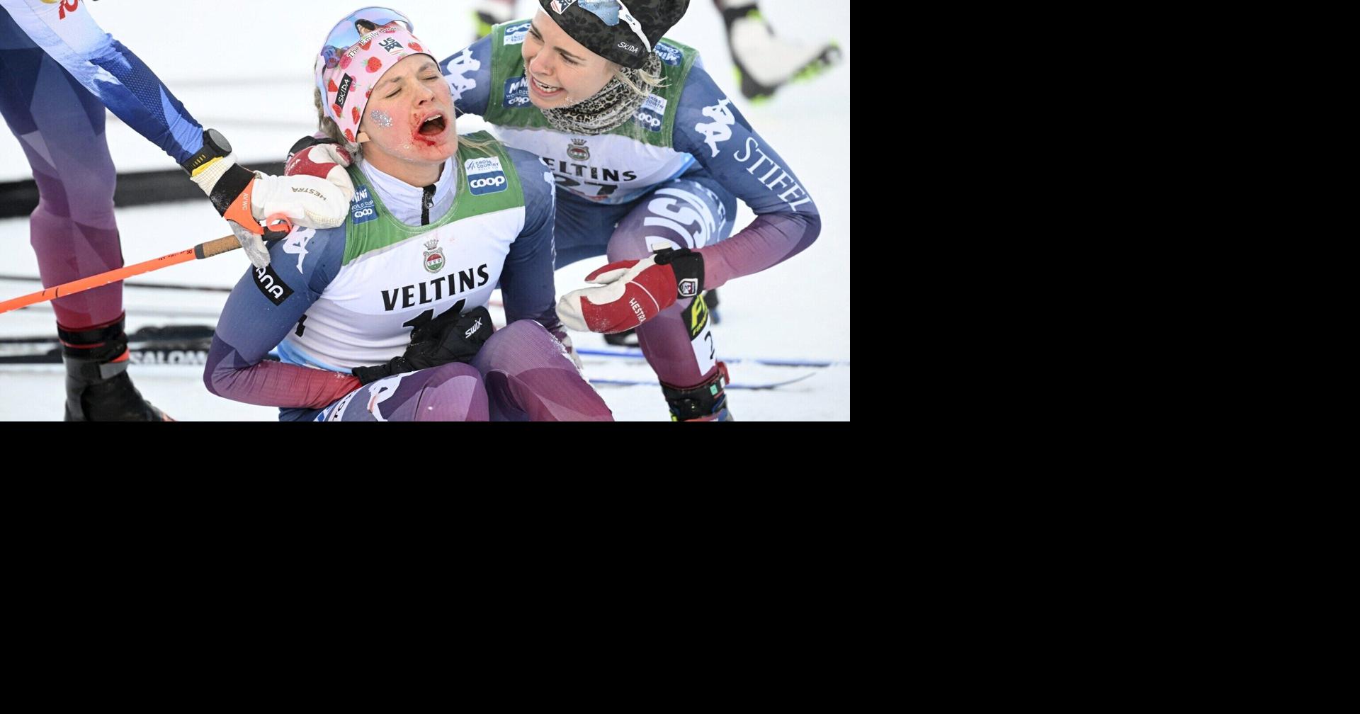 Injured Jessie Diggins of USA (L) reacts with Sophia Laukli of USA