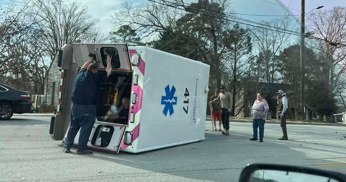 UPDATE: 3 people hurt after car crashes into ambulance on E. Brainerd Rd.